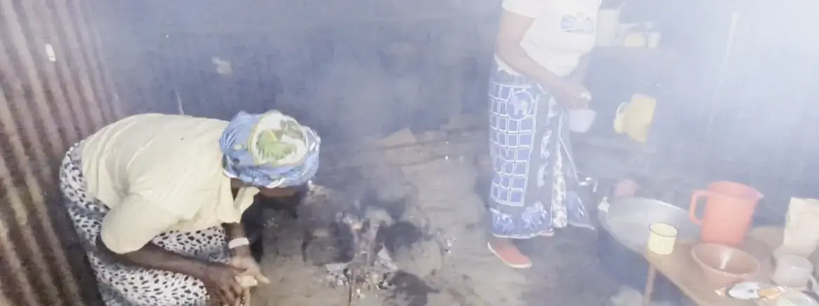 Ladies cooking on wood fire